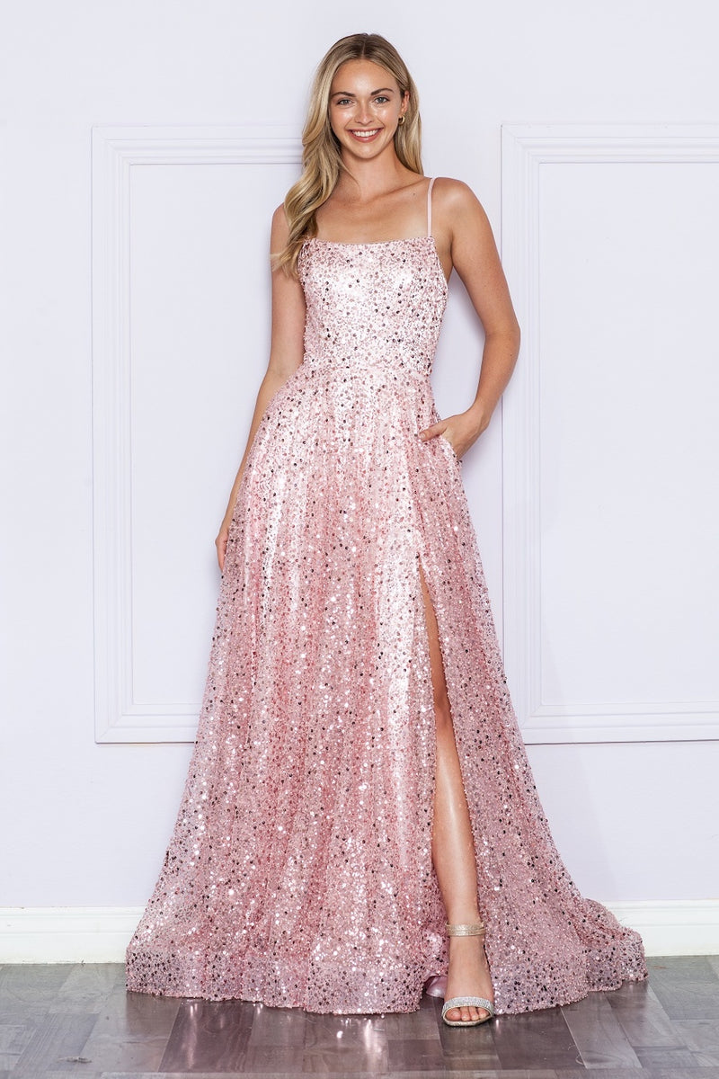 This dress features a straight across neckline with spaghetti straps and a lace-up back. This gown has an A-line silhouette with pockets and unique sequin fabric and a slit. A stunning choice for your next prom or formal event.  PY 9290