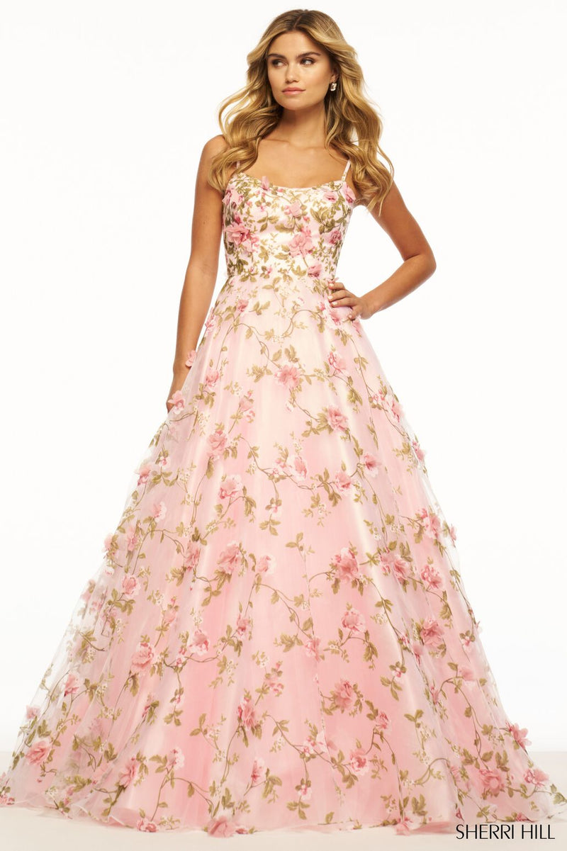 This Sherri Hill ballgown features 3D flower detailing with a lace-up back. A beautiful gown that could be perfect for your next prom or formal event.   Sherri Hill 56107