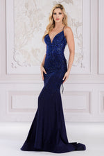 This dress features a V-neckline with spaghetti straps and an open lace-up back. The silhouette is a fit and flare with stone embellishments throughout the bodice and torso that trickle down the skirt. This is an excellent choice for your next prom or formal event.   ACE 3018