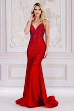 This dress features a V-neckline with spaghetti straps and an open lace-up back. The silhouette is a fit and flare with stone embellishments throughout the bodice and torso that trickle down the skirt. This is an excellent choice for your next prom or formal event.   ACE 3018
