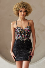 This cocktail dress features a sweetheart neckline with spaghetti straps and a lace-up back. The fitted silhouette is complimented with the sequin fabric and floral pattern on the bodice. Choose this style for your next homecoming or formal event.

ACE 7054S