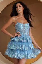 This cocktail dress features an illusion-plunging neckline with a sheer corset bodice and lace embellishments, spaghetti straps, and a lace-up back. The skirt has tiered layers with lace on the hem. This dress is feminine and unique and could be perfect for your next homecoming or formal event.  ACE BZ9031S
