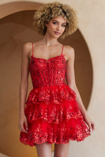 This cocktail dress features an illusion-plunging neckline with a sheer corset bodice and lace embellishments, spaghetti straps, and a lace-up back. The skirt has tiered layers with lace on the hem. This dress is feminine and unique and could be perfect for your next homecoming or formal event.  ACE BZ9031S