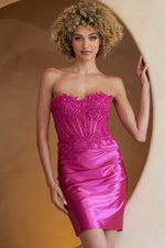 This cocktail dress features a strapless sweetheart neckline with a sheer corset bodice with lace embellishments, a fitted silhouette and a lace-up back. Style this dress to make it your own at your next homecoming or formal event!  ACE BZ9028S