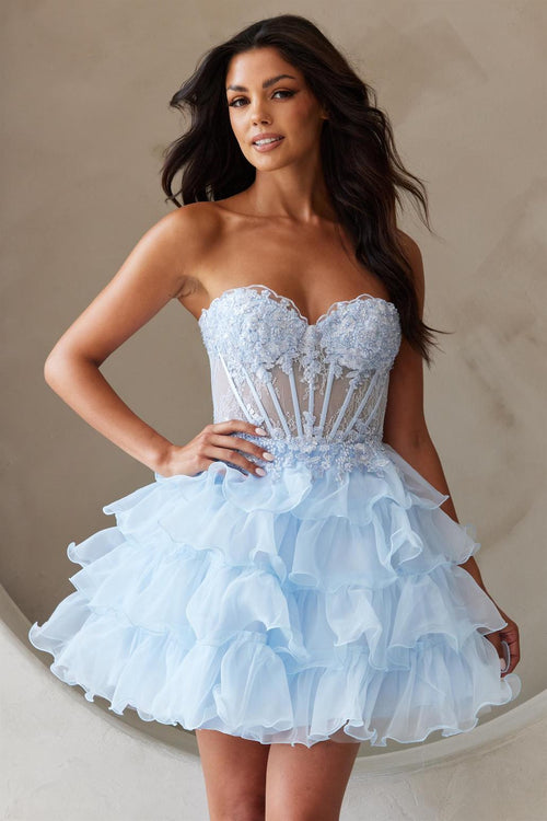This cocktail dress features a strapless sweetheart neckline with a sheer corset bodice with lace applique and an A-line skirt with tiered layers. The lace-up back allows for a perfect fit at your next homecoming or formal event.&nbsp;  ACE BZ9032S