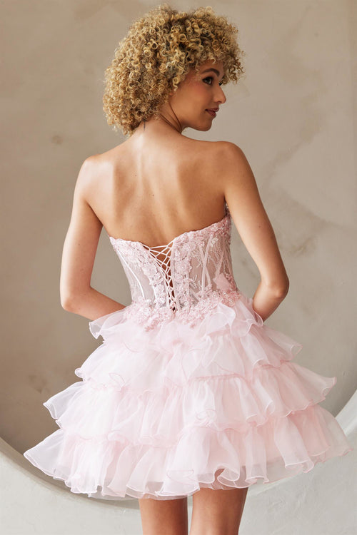 This cocktail dress features a strapless sweetheart neckline with a sheer corset bodice with lace applique and an A-line skirt with tiered layers. The lace-up back allows for a perfect fit at your next homecoming or formal event.&nbsp;  ACE BZ9032S