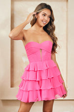 This cocktail dress features a strapless sweetheart neckline with a bodice with corset boning, a cut-out and pleated detailing, a skirt with layered tiers creating an A-line silhouette. Style this dress to make it your own at your next homecoming or formal event.

ACE 2063S