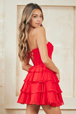 This cocktail dress features a strapless sweetheart neckline with a bodice with corset boning, a cut-out and pleated detailing, a skirt with layered tiers creating an A-line silhouette. Style this dress to make it your own at your next homecoming or formal event.

ACE 2063S