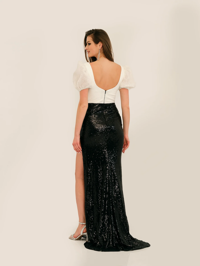 This dress features a fitted bodice with a sweetheart neckline and puff sleeves, sequin mesh fabric and a fitted silhouette. This dress is unique and feminine and could be just the vibe for your next prom or formal event.   DJ 11328