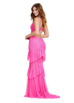 This dress features fully beaded fabric in an intricate design pattern with spaghetti straps a v-neckline and cut-out on the side to reveal an open back. This dress has stretch tulle fabric ruffles tiered throughout the skirt and a middle slit. This dress is one-of-a-kind, a stand out option for your next prom or formal event.  Ashley Lauren 11437