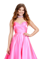 This elegant ballgown features a strapless sweethearts neckline, with subtle pleating detailing on the bodice. The gown has an A-line silhouette with a train a classic and timeless choice for your next prom or formal event.  Ashley Lauren 11473