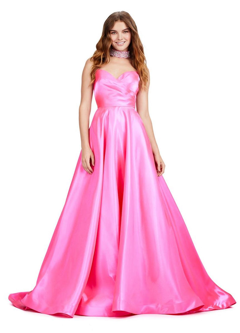 This elegant ballgown features a strapless sweethearts neckline, with subtle pleating detailing on the bodice. The gown has an A-line silhouette with a train a classic and timeless choice for your next prom or formal event.  Ashley Lauren 11473