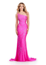 This one-shoulder jersey gown features a delicate multi-colored heat set stone floral bead pattern that cascades down onto the skirt with a sweep train. This dress has a fitted silhouette and could be ideal for your next prom or formal event.  Ashley Lauren 11525