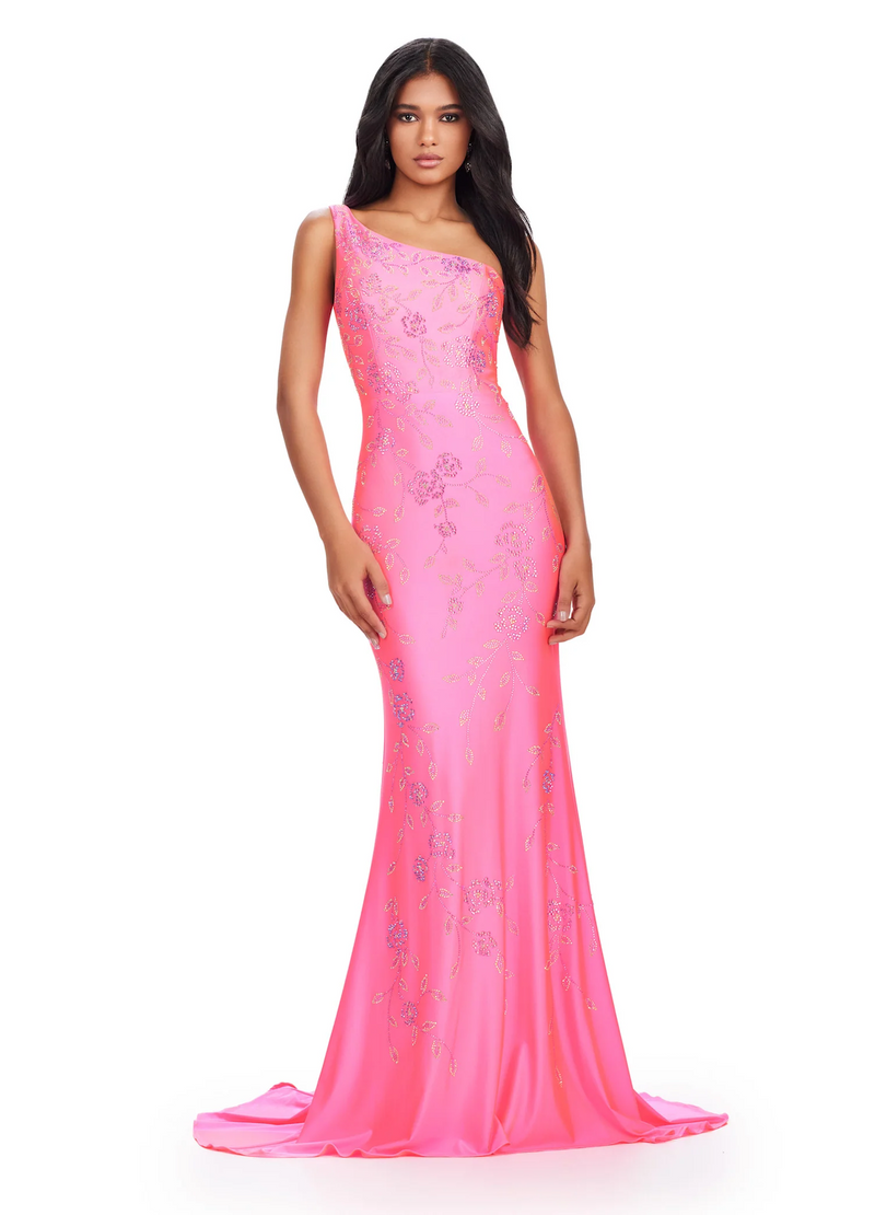 This one-shoulder jersey gown features a delicate multi-colored heat set stone floral bead pattern that cascades down onto the skirt with a sweep train. This dress has a fitted silhouette and could be ideal for your next prom or formal event.  Ashley Lauren 11525