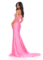 This one-shoulder jersey gown features a delicate multi-colored heat set stone floral bead pattern that cascades down onto the skirt with a sweep train. This dress has a fitted silhouette and could be ideal for your next prom or formal event.  Ashley Lauren 11525