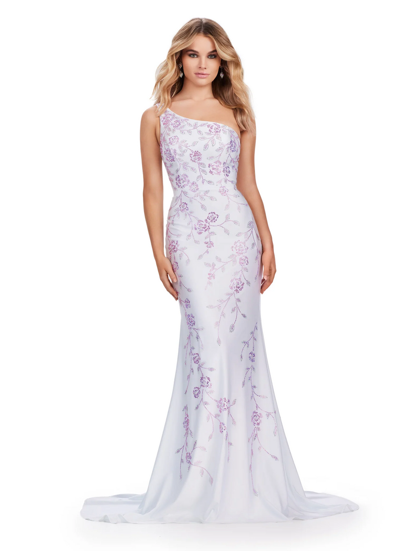This one-shoulder jersey gown features a delicate multi-colored heat set stone floral bead pattern that cascades down onto the skirt with a sweep train. This dress has a fitted silhouette and could be ideal for your next prom or formal event.  Ashley Lauren 11525