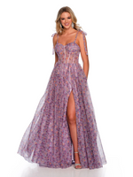 This dress features a sheer illusion corset bodice with tie straps, and illusion lace-up back, a full sweeping skirt with a side slit and asymmetrical ruffle detail all on a printed tulle. This dress is playful and feminine and ideal for your prom or formal event.   DJ 11591