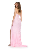 This show-stopping gown features a strapless neckline, fitted silhouette, a skirt slit, and is embellished with hot-pressed stoning and pearl beading. Pair this dress with some simple heels for a unique prom look.&nbsp;

Ashley Lauren 11856&nbsp;