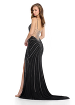 This stunning gown features a fitted silhouette, Asymmetrical cutouts, and hot pressed stoning details along the dress. Pair this dress with some fun earrings for the perfect prom or pageant look.&nbsp;

Ashley Lauren 11902&nbsp;