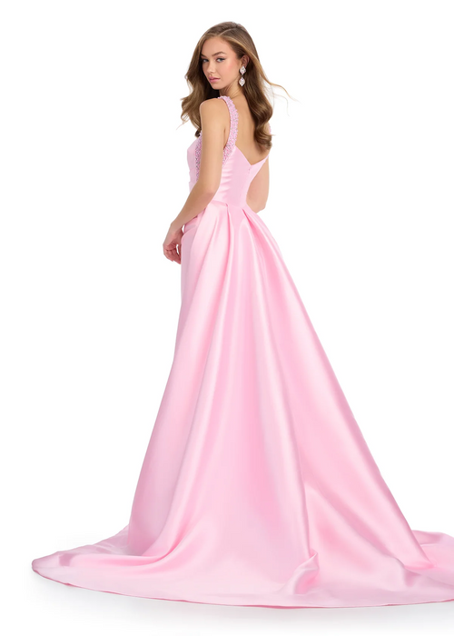 This mikado gown features fully beaded straps and a ruched bodice. Complete with a sweeping overskirt, and a column skirt, this dress may be perfect for your next prom or pageant.

Ashley Lauren 11979