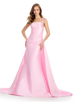 This mikado gown features fully beaded straps and a ruched bodice. Complete with a sweeping overskirt, and a column skirt, this dress may be perfect for your next prom or pageant.

Ashley Lauren 11979
