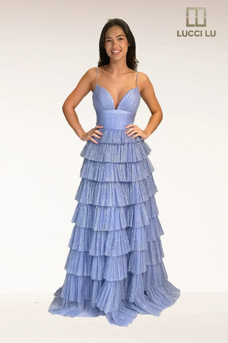 This dress features a v-neckline with spaghetti straps, a cinched waistline, and an A-line silhouette. The skirt has layered ruffle tulle all in a glitter fabric. This dress is playful and feminine and an excellent choice for your next prom or formal event.  LU 1342