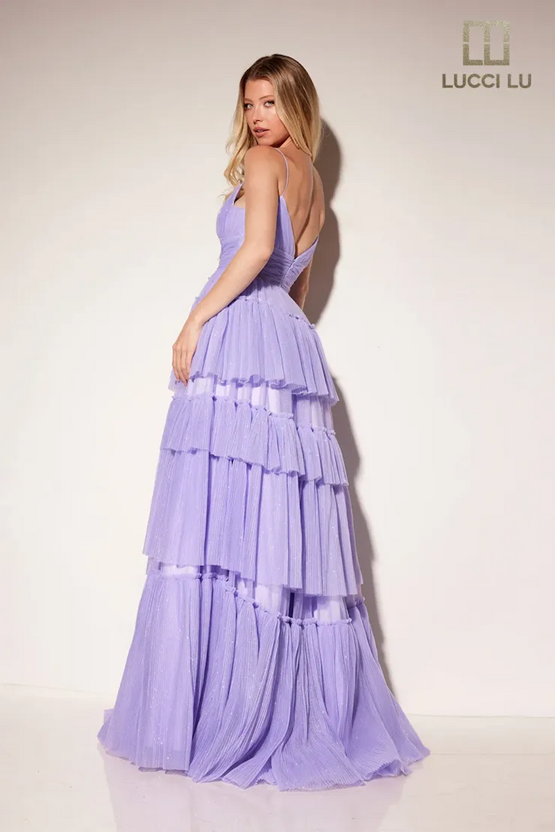 This dress features a v-neckline, an A-line silhouette, spaghetti straps, a cinched ruched waistline with a layered tulle skirt. A whimsical and playful design, this dress can be styled to make it your own at your next prom or formal event.  LU 1357