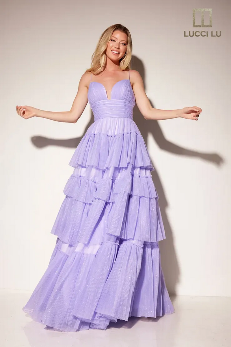 This dress features a v-neckline, an A-line silhouette, spaghetti straps, a cinched ruched waistline with a layered tulle skirt. A whimsical and playful design, this dress can be styled to make it your own at your next prom or formal event.  LU 1357