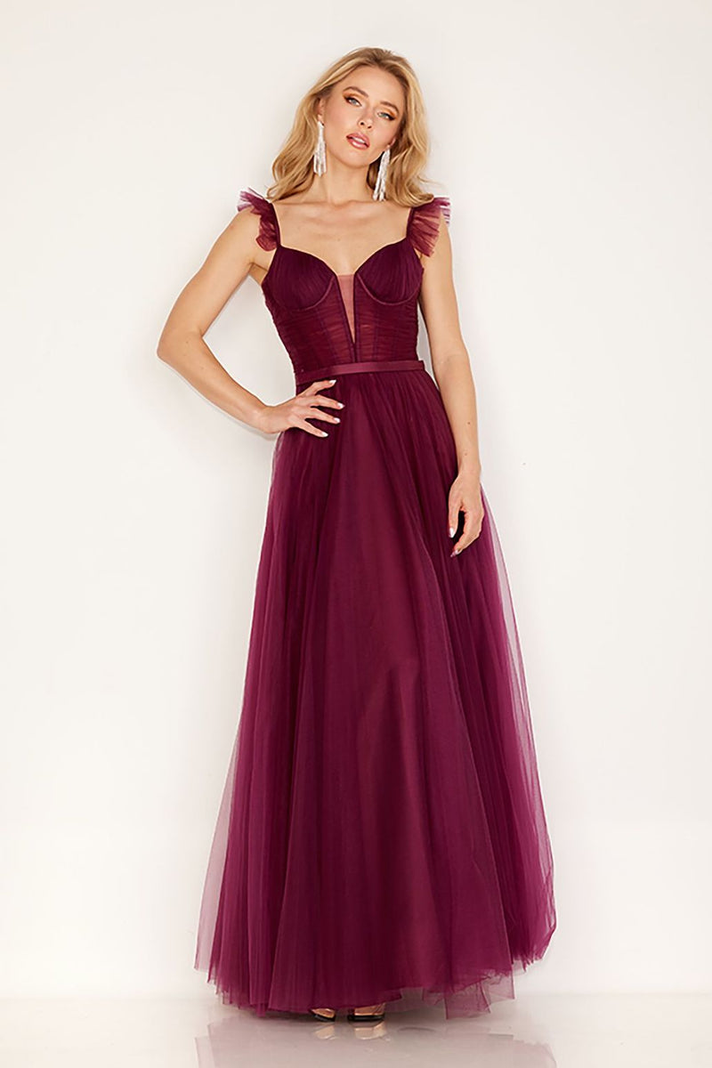 This dress features an illusion v-neckline, with spaghetti straps with tulle detailing. The bodice has exposed corset boning, tulle fabric, and an A-line silhouette. This dress is an effortless choice for your next prom or formal event.   CAC 163