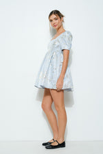 This cocktail dress features a square neckline with short sleeves and a babydoll fit and flare silhouette with a metallic jacquard fabric. This is a chic choice for your next homecoming or formal event.

IDK IDK8227