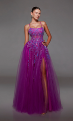 This dress features a straight across neckline with a sheer bodice with corset boning, a lace-up open back, adjustable spaghetti straps, and lace embellished tulle. The full skirt offers an A-line silhouette with a slit. This dress is ethereal and could be ideal for your next prom or formal event.   Alyce 1785