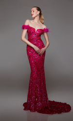 This dress features an off-the-shoulder neckline with feather trim on the shoulders, a sequin fabric with a paisley design, a lace-up back and a train. This dress is one-of-a-kind and ideal for your next prom, pageant, or formal event.  Alyce 1789