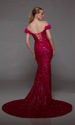 This dress features an off-the-shoulder neckline with feather trim on the shoulders, a sequin fabric with a paisley design, a lace-up back and a train. This dress is one-of-a-kind and ideal for your next prom, pageant, or formal event.  Alyce 1789