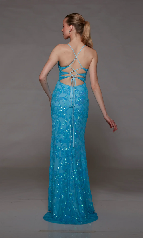 This dress features a plunging neckline with spaghetti straps and a unique lace-up back. The fabric is embellished with sequins in an intricate pattern with a fitted silhouette and a slit in the skirt. This dress may be just the vibe for your next prom or formal event.  AY 1811