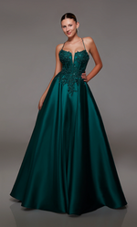 This dress features a lace applique bodice with corset boning and a deep v-neckline. This gown has spaghetti straps and an open lace-up back with an A-line silhouette. Choose this romantic dress for your next prom or formal event.  Alyce 1817