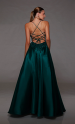 This dress features a lace applique bodice with corset boning and a deep v-neckline. This gown has spaghetti straps and an open lace-up back with an A-line silhouette. Choose this romantic dress for your next prom or formal event.  Alyce 1817