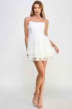 This cocktail dress features a strapless neckline with an A-line silhouette and a layered tulle-tiered skirt. Style this dress to make it your own at your next homecoming or formal event.  VT VID10761