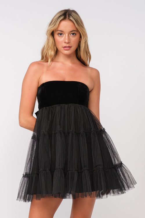 This dress features a strapless neckline with a velvet bodice with a tie-bow in the back and a tulle ruffle layered skirt. This dress is playful and feminine and could be ideal for your next homecoming, sweethearts or formal event!  SM-D20506A