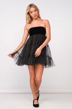 This dress features a strapless neckline with a velvet bodice with a tie-bow in the back and a tulle ruffle layered skirt. This dress is playful and feminine and could be ideal for your next homecoming, sweethearts or formal event!  SM-D20506A