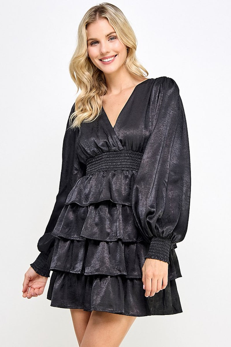 This dress features a v-neckline, long sleeves with fitted cuffs, a cinched waist, and tiered ruffle layers. An ideal cocktail dress for your next sweethearts or homecoming dance or any formal event!  CAR-CD8750S