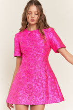 <p>This modest cocktail dress features a brocade-style fabric with a short sleeve, a high neckline, a fully covered back, and an A-line silhouette. This dress is cute and modern and could be styled to make it your own at your next homecoming, sweethearts dance or formal event.</p> <p>ITB D10042</p>