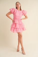 This modest cocktail dress features puff sleeves, plaid organza jacquard fabric, a round neckline and a ruffle waist with a tiered layered skirt. Style this dress to make it your own at your next homecoming or formal event!  MCI MDR2968