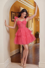 This cocktail dress features tulle fabric with a tiered ruffle skirt, tie shoulder straps, with a sheer corset bodice. This dress is playful and could be just the vibe for your next homecoming or formal event.  BFX Y858
