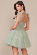 This cocktail dress features tulle fabric with a tiered ruffle skirt, tie shoulder straps, with a sheer corset bodice. This dress is playful and could be just the vibe for your next homecoming or formal event.  BFX Y858