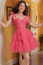 This cocktail dress features tulle fabric with a tiered ruffle skirt, tie shoulder straps, with a sheer corset bodice. This dress is playful and could be just the vibe for your next homecoming or formal event.  BFX Y858