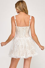 This lace corset mini dress features a flared skirt and spaghetti straps, a square neckline with lace trim and a corset lace-up back. This dress has a boho vibe and could be ideal for your next homecoming or formal event!

TVS VID50697-8