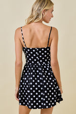 This cocktail dress features a straight across neckline with a ruched bodice, spaghetti straps, and a polka dot print with an A-line silhouette.&nbsp;

DW G6660