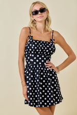 This cocktail dress features a straight across neckline with a ruched bodice, spaghetti straps, and a polka dot print with an A-line silhouette.&nbsp;

DW G6660