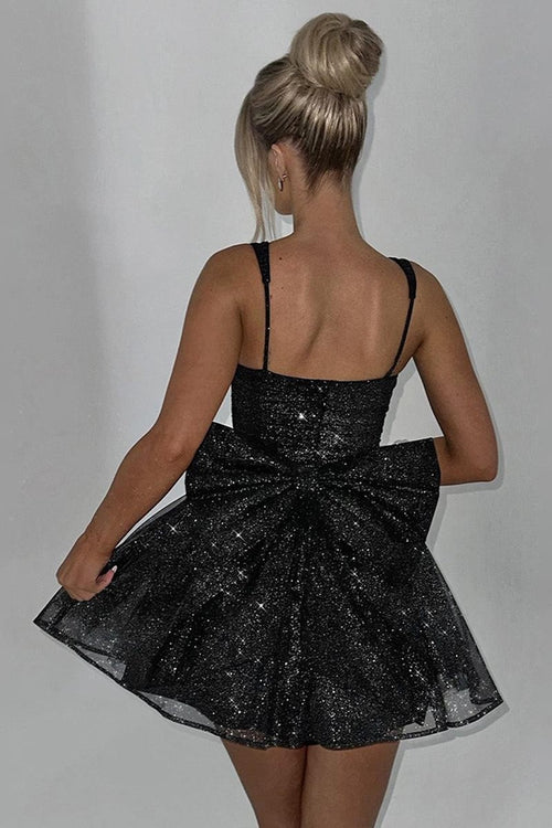 This cocktail dress features a shimmering tulle fabric with thin straps, a ruched bodice, a dramatic bow in the back, and an A-line silhouette. This dress is romantic and could be ideal for your next homecoming or formal event.&nbsp;

HIC HGMI56001D