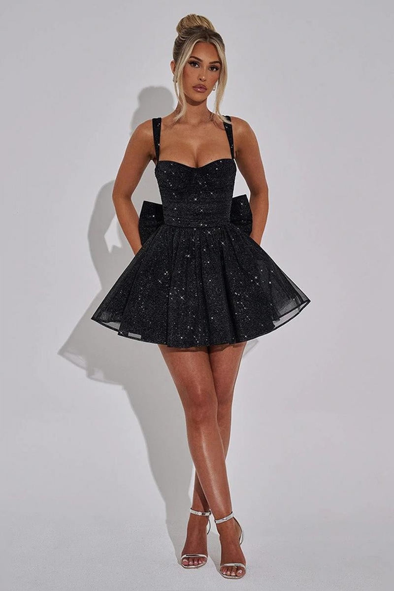 This cocktail dress features a shimmering tulle fabric with thin straps, a ruched bodice, a dramatic bow in the back, and an A-line silhouette. This dress is romantic and could be ideal for your next homecoming or formal event.&nbsp;

HIC HGMI56001D